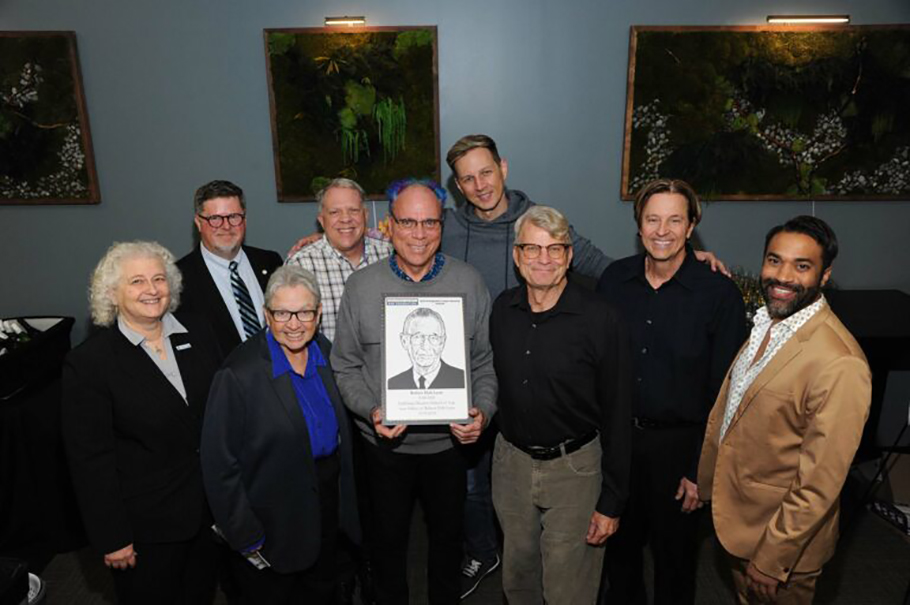 Board members honoring an inductee into the Distinguished Lawyers Memorial.