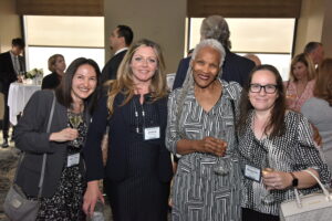 4 women attendees at a Distinguished Lawyer Memorial Celebration